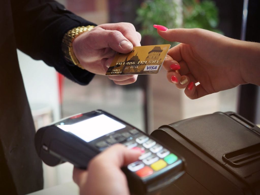 black-payment-terminal-2988232 Close-up of a credit card payment being processed at a POS terminal.