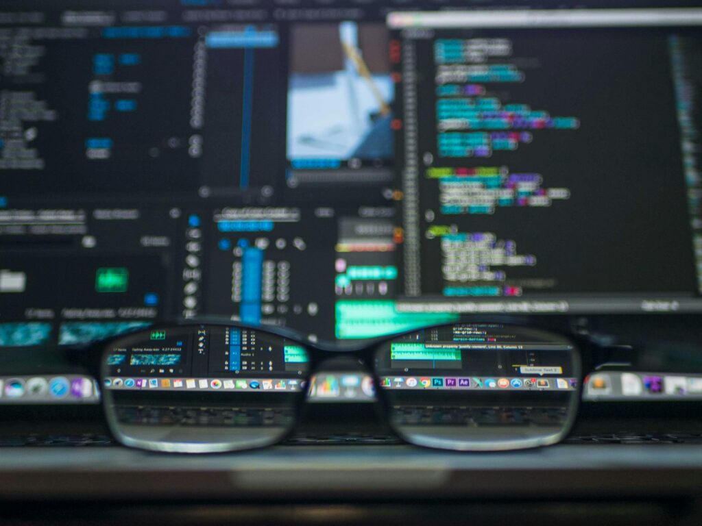 pexels photo 577585 577585 Eyeglasses reflecting computer code on a monitor, ideal for technology and programming themes.